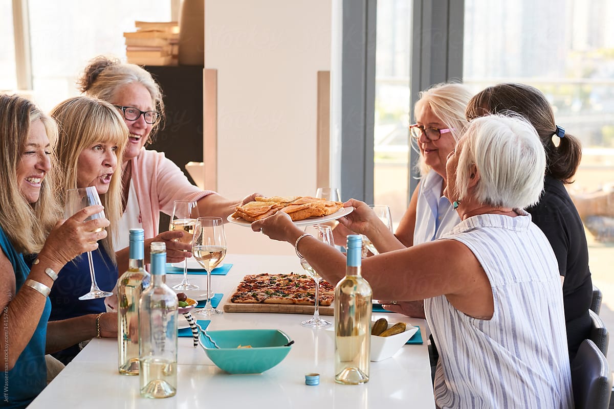 Senior Women Friends Enjoying Wine and Company