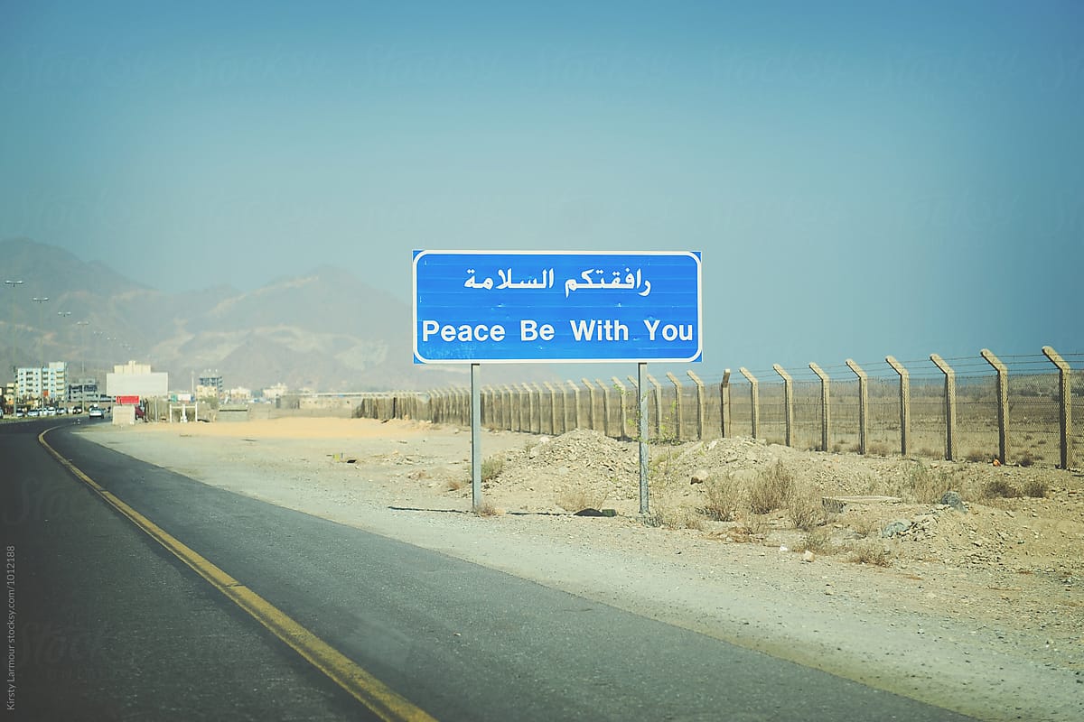 A sign on the roadside in the United Arab Emirates says \