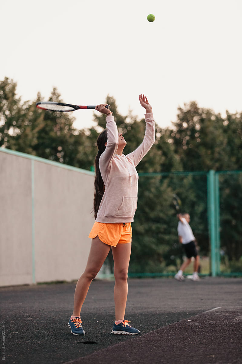 Woman serve ball playing tennis game outdoor sport