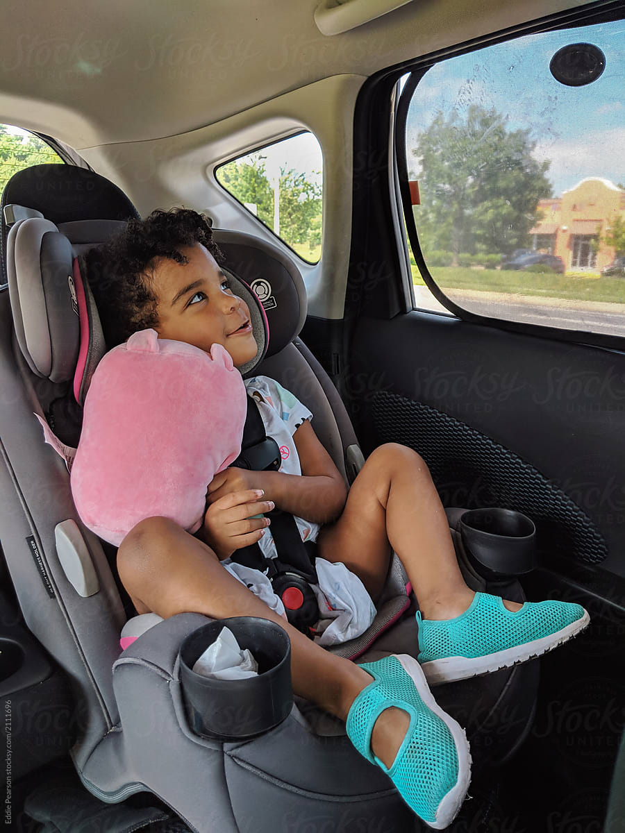 Little girl in her car seat