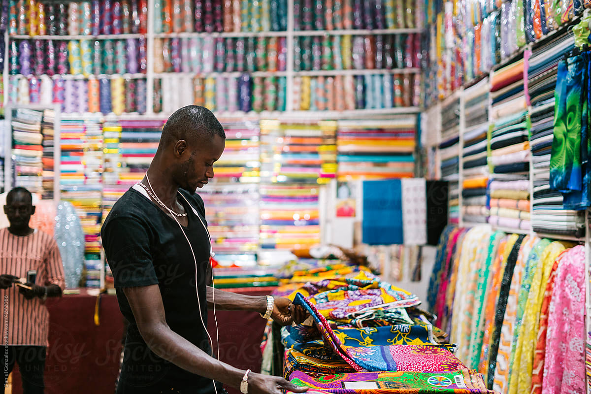 Black man working in textile store