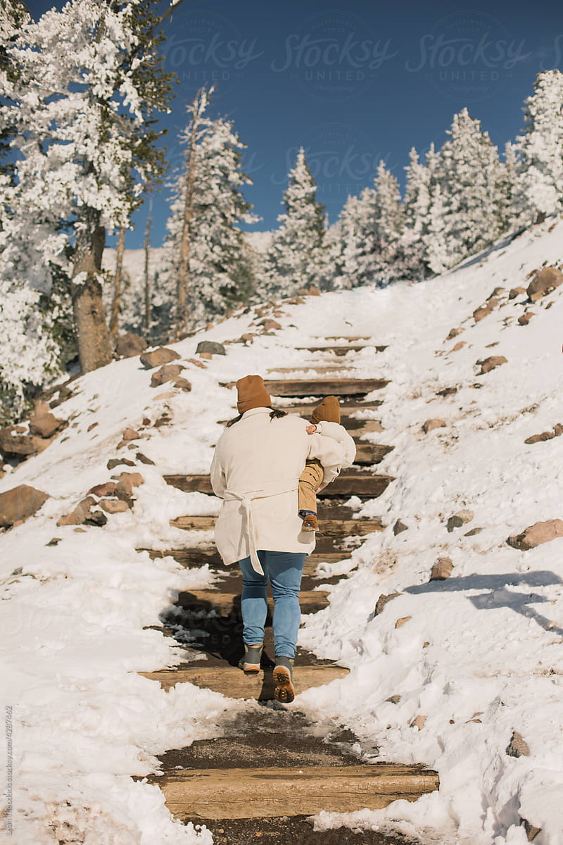 Plus Size Woman Hiking In Snow by Stocksy Contributor Leah