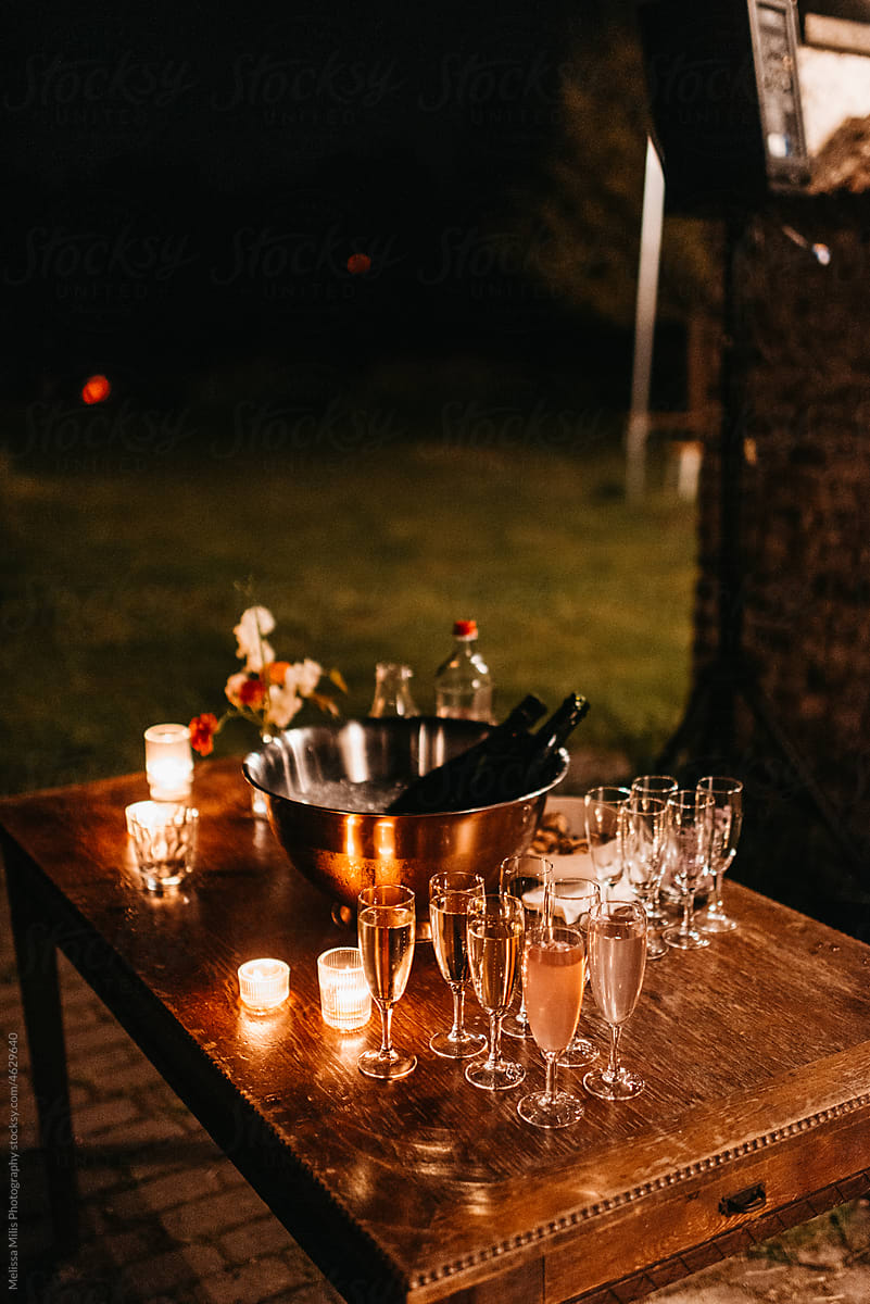 outdoor table with drinks and candles