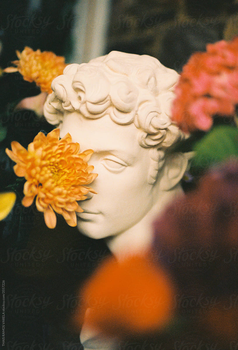 sculpture and flowers on film.