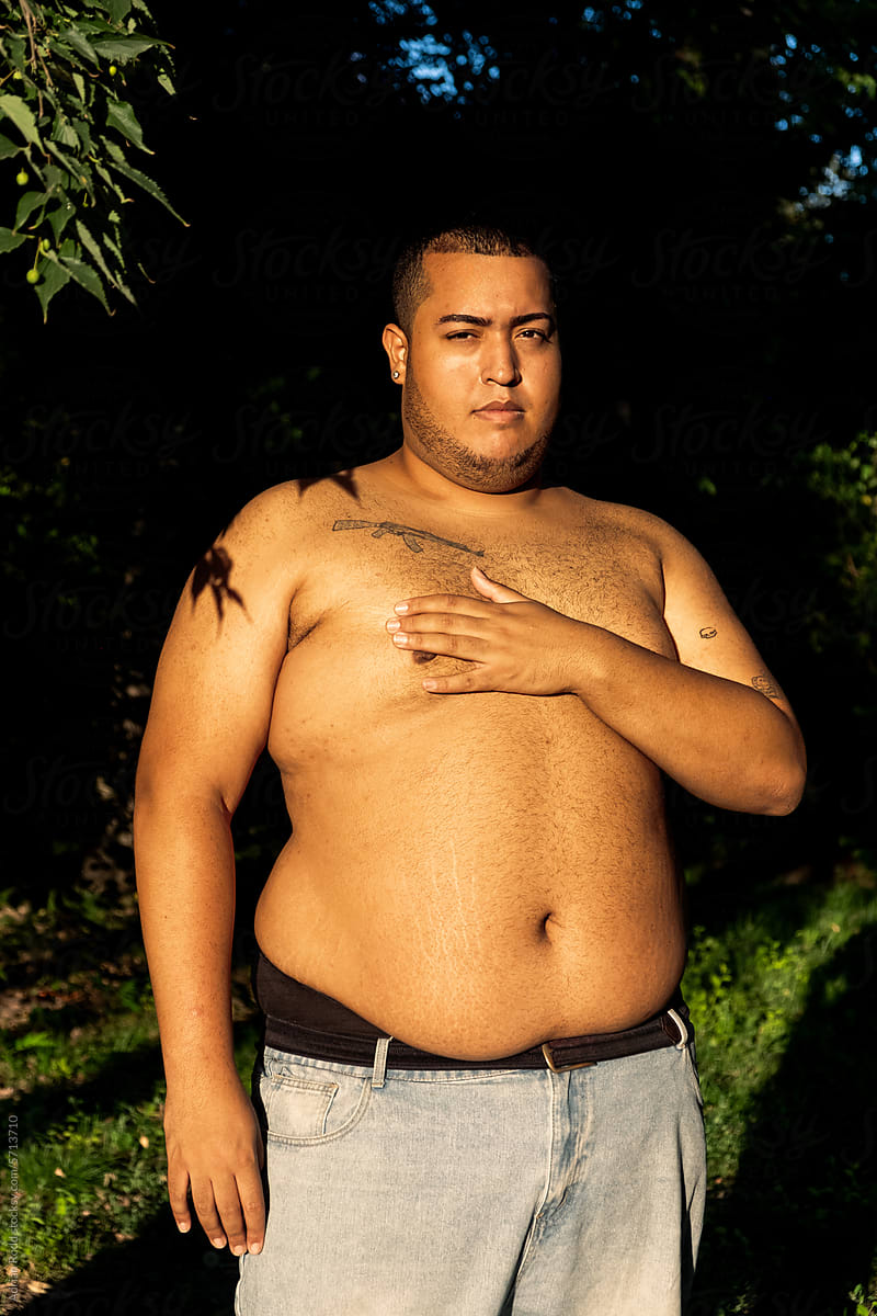 Portrait of a shirtless plus-size black boy