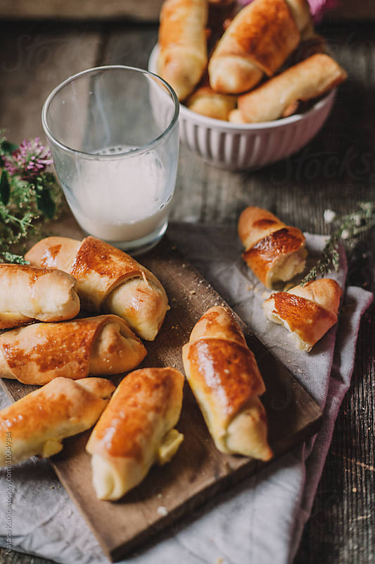 Baked rolls and a glass of milk