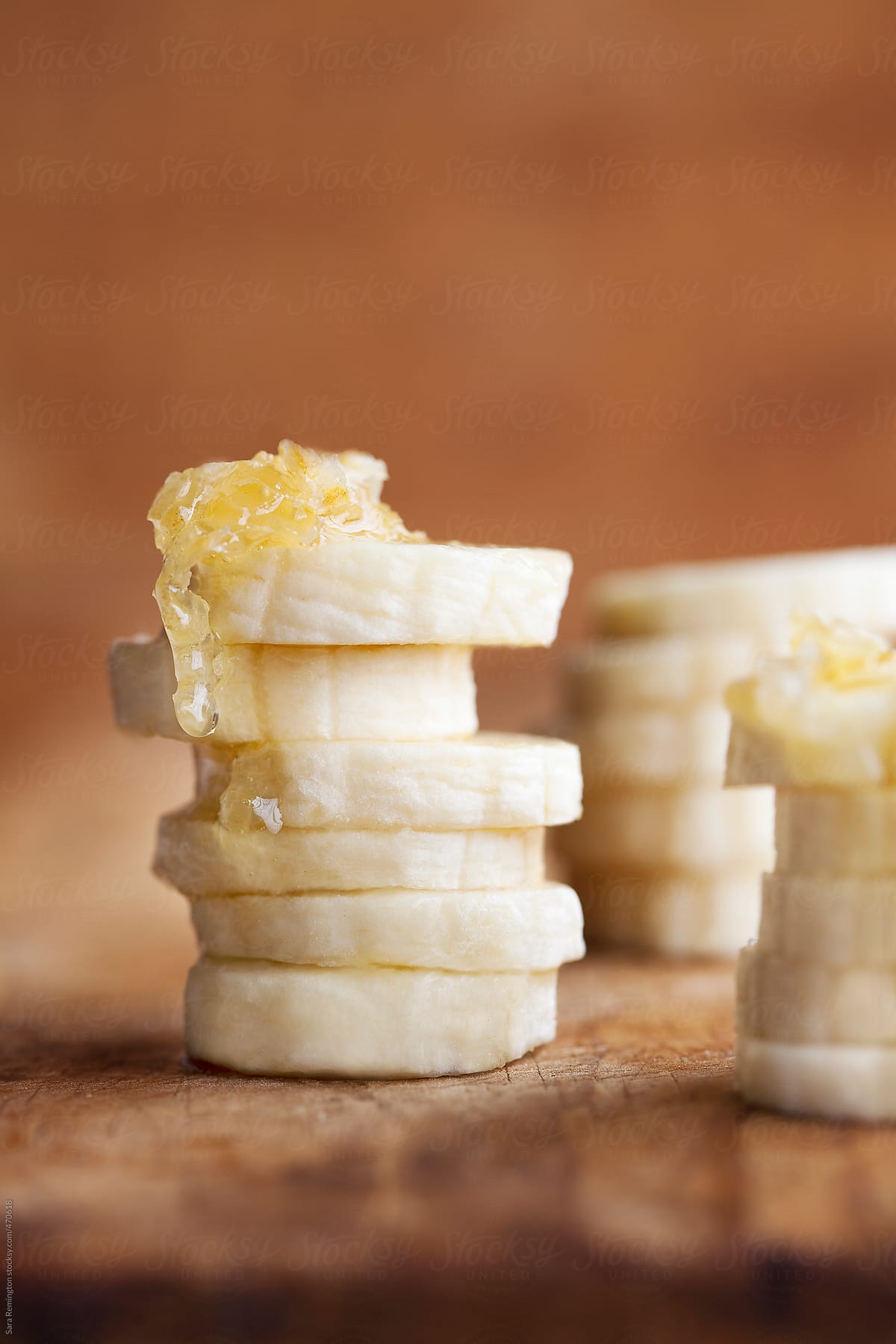Pile of Sliced Bananas with Honey on Top