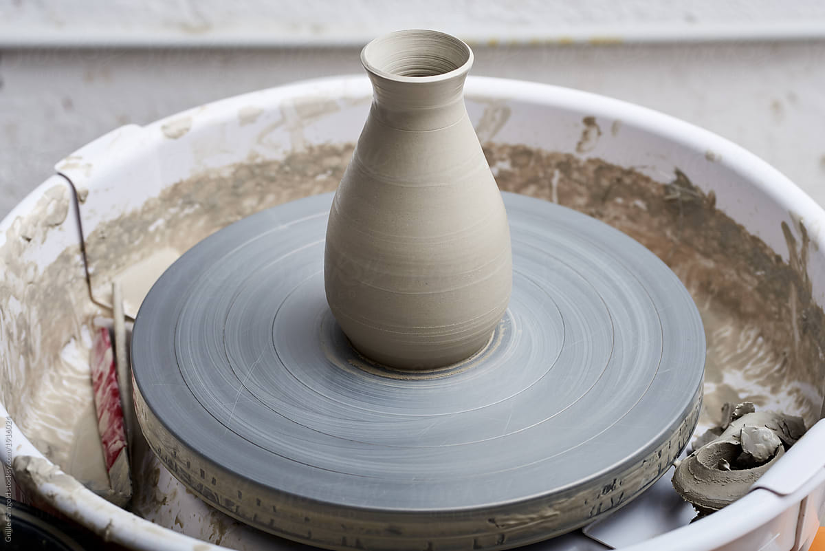 Handmade clay vase on pottery wheel.