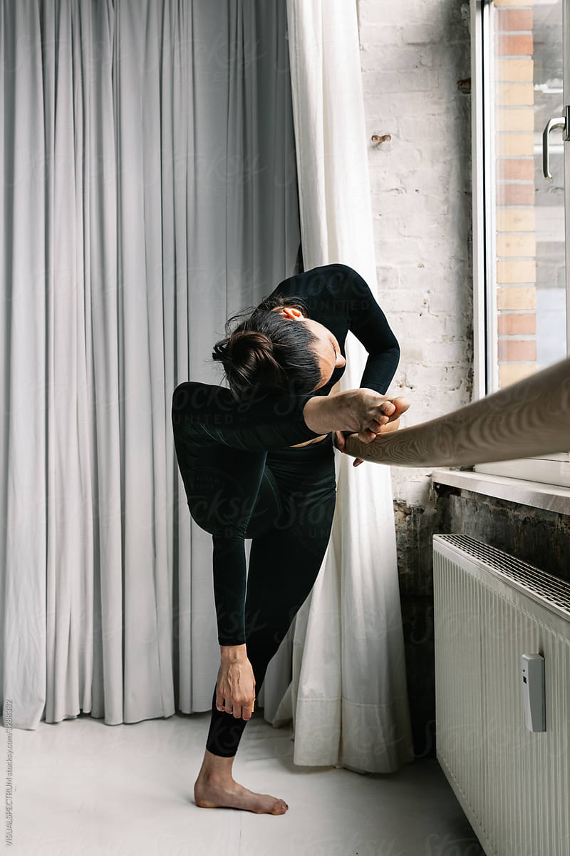 Dancer Stretching With Barre