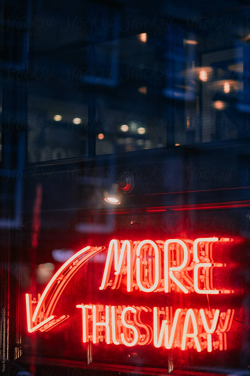 \'More this way\' red neon