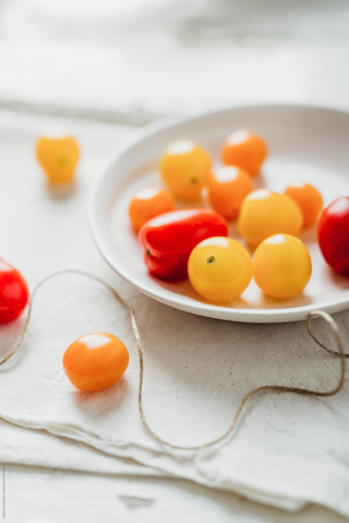 Yellow, orange and red cherry tomato