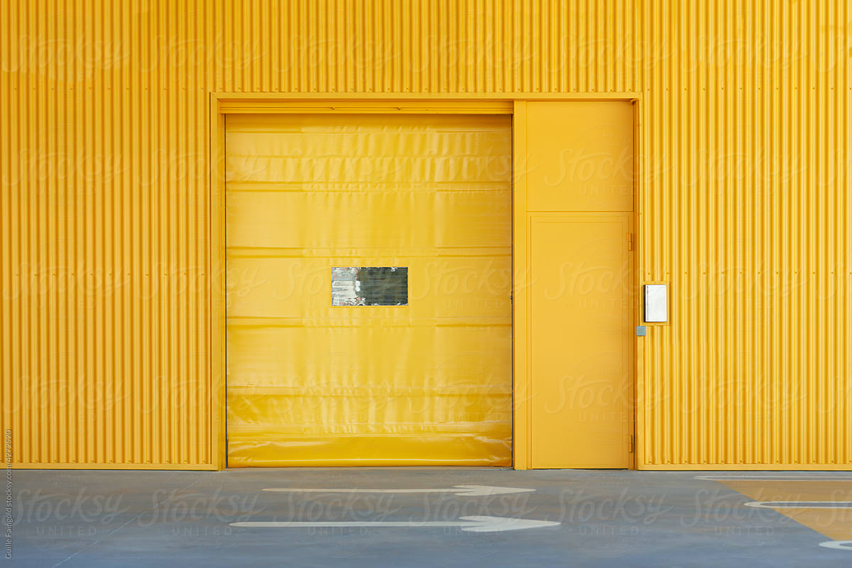 Vivid yellow wall with gate