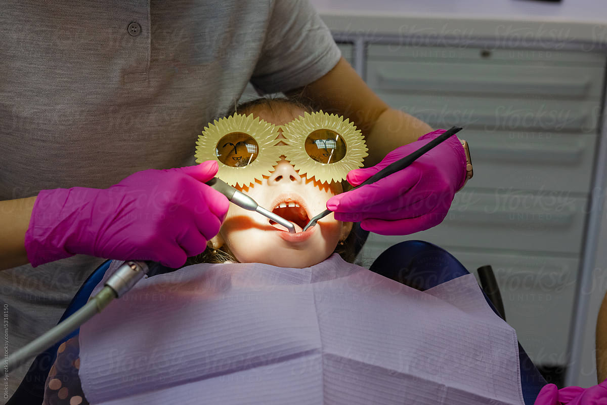 Anonymous doc child patient dentistry procedure medical equipment
