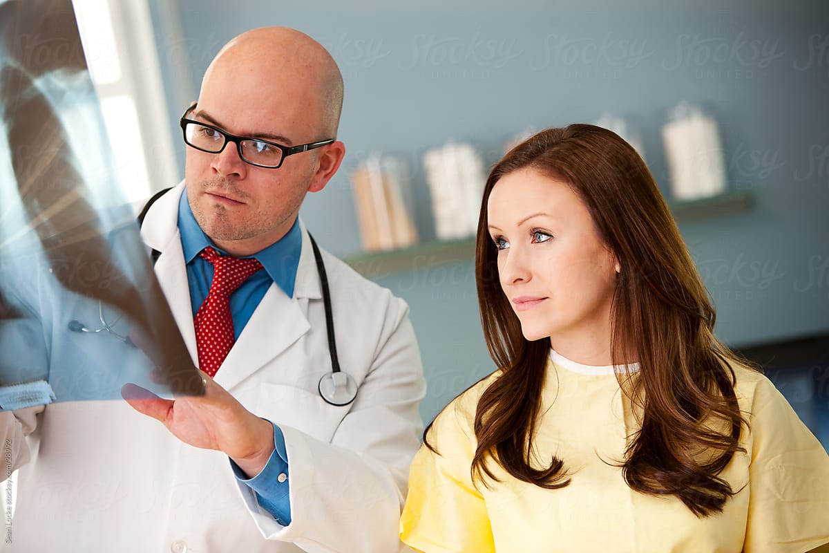 Exam Room: Doctor Discusses X-ray with Patient