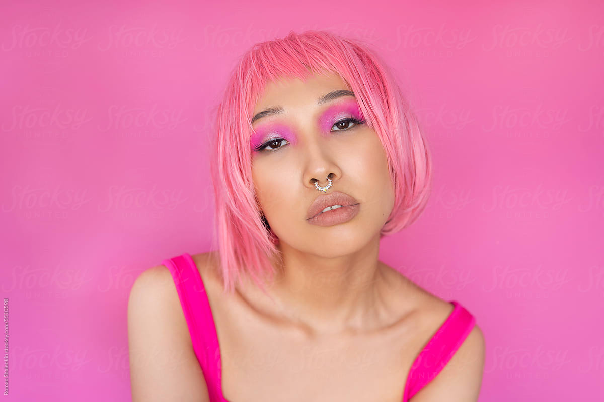 Asian woman with pink hair