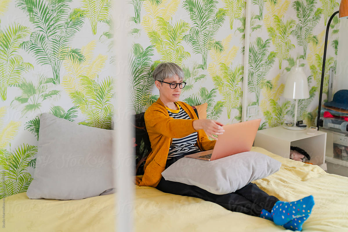 Mature Woman Working on Laptop at Home
