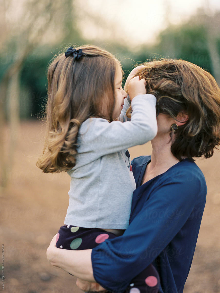 Mother And Daughter Holding Each Other And Smiling By Stocksy Contributor Jakob Lagerstedt