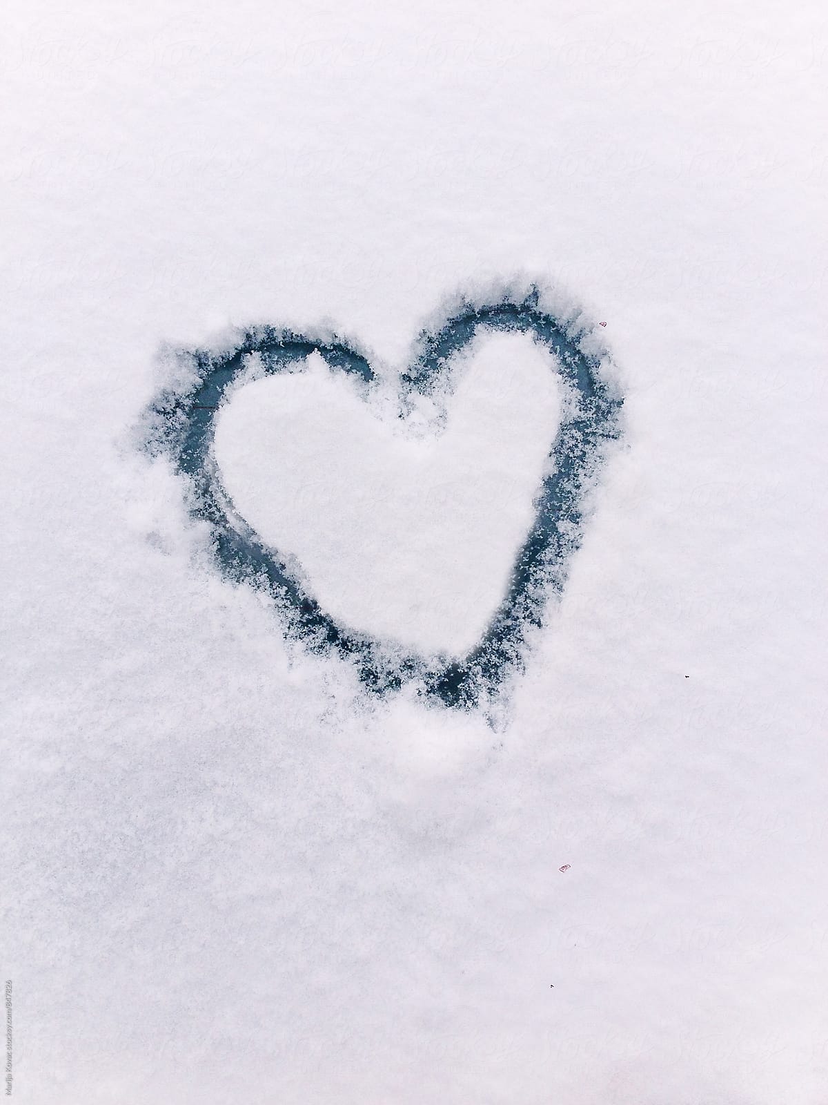 Heart drawn in a snow