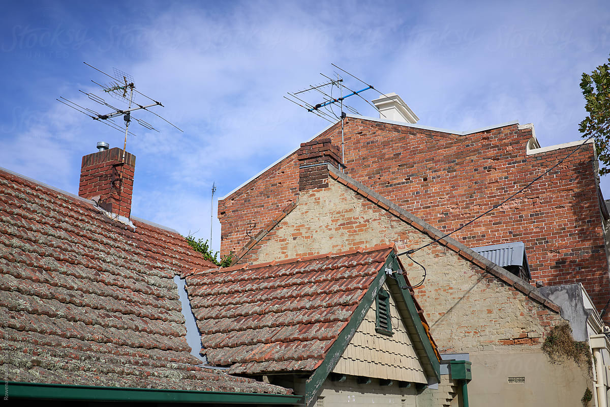 Three houses with different roof levels