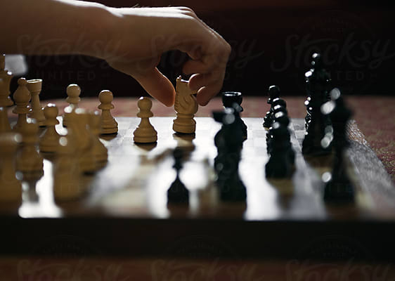 Boy Contemplates His Next Chess Move by Stocksy Contributor Cara Dolan -  Stocksy