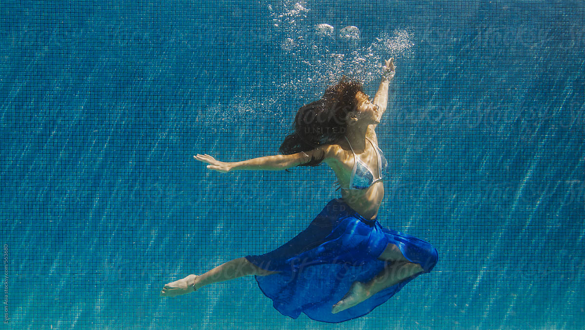 Underwater in blue summer skirt