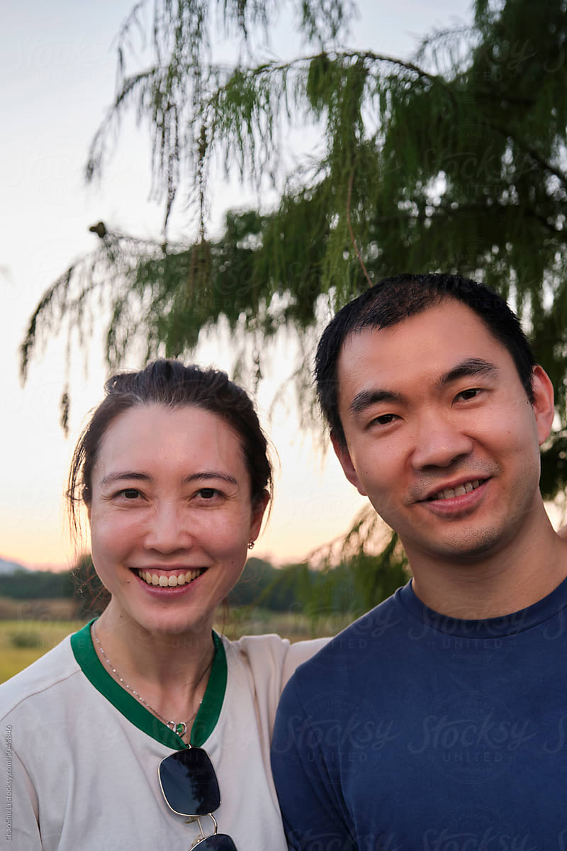 Asian couple next to the rice field outdoors