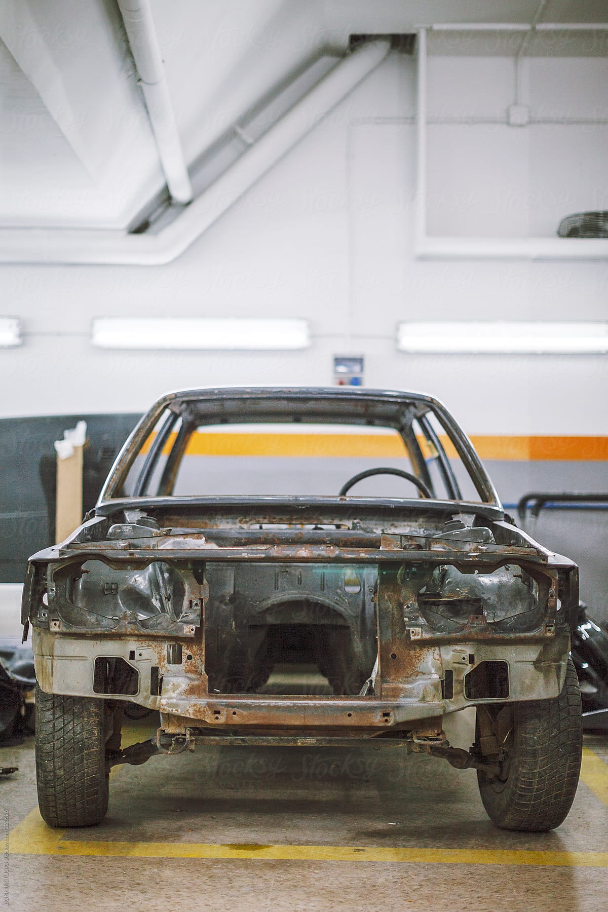 The bodywork of a vintage vehicle on a car workshop.