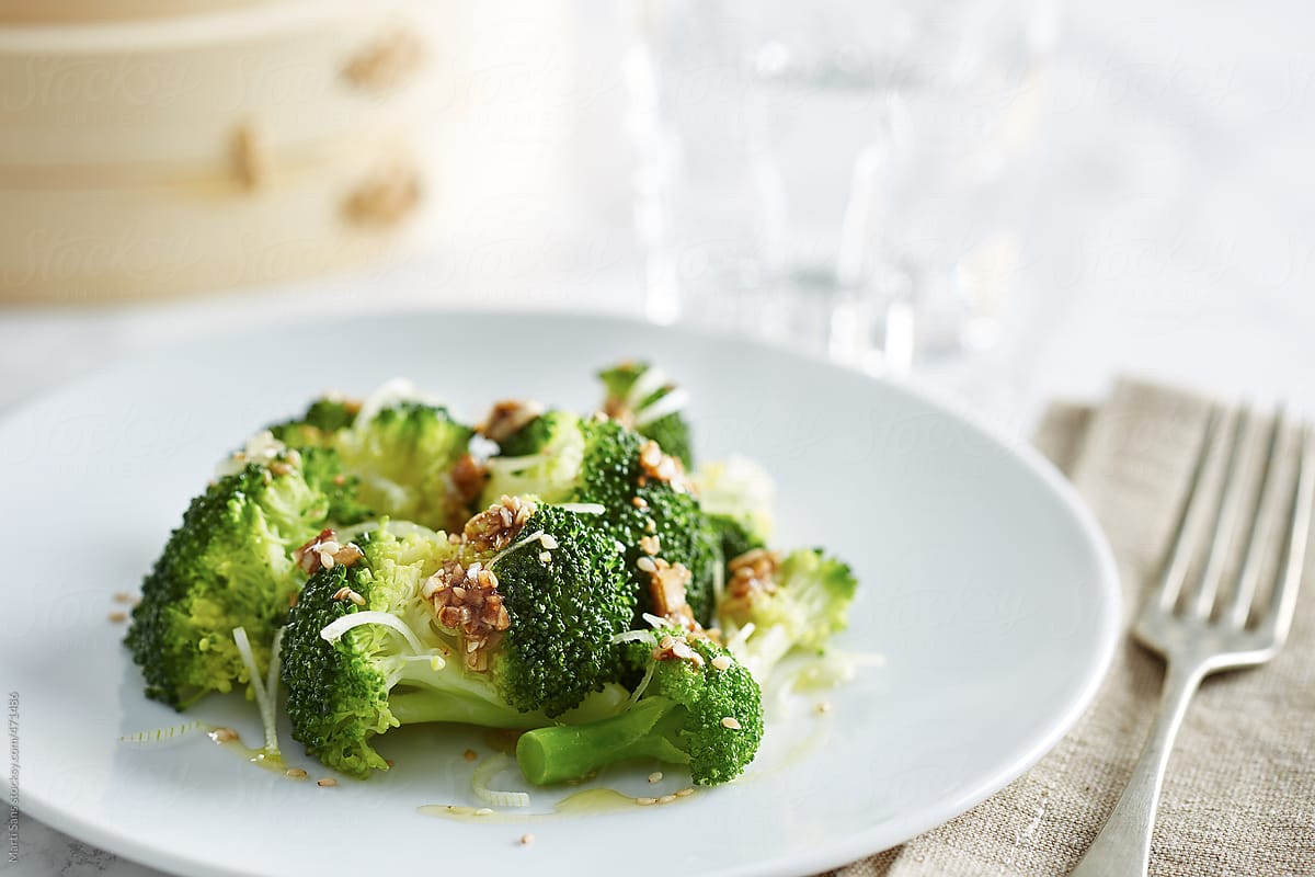 Steamed broccoli dish, fork