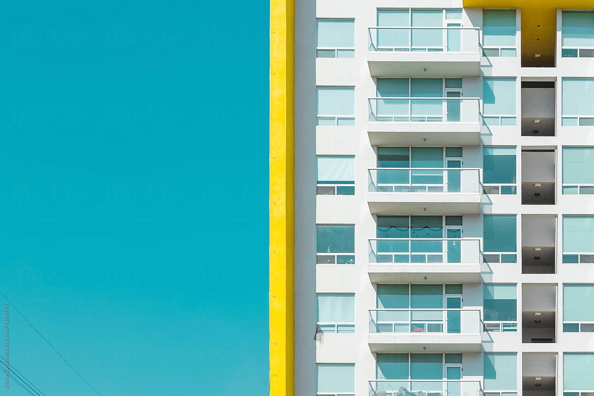 White building with a yellow vertical line