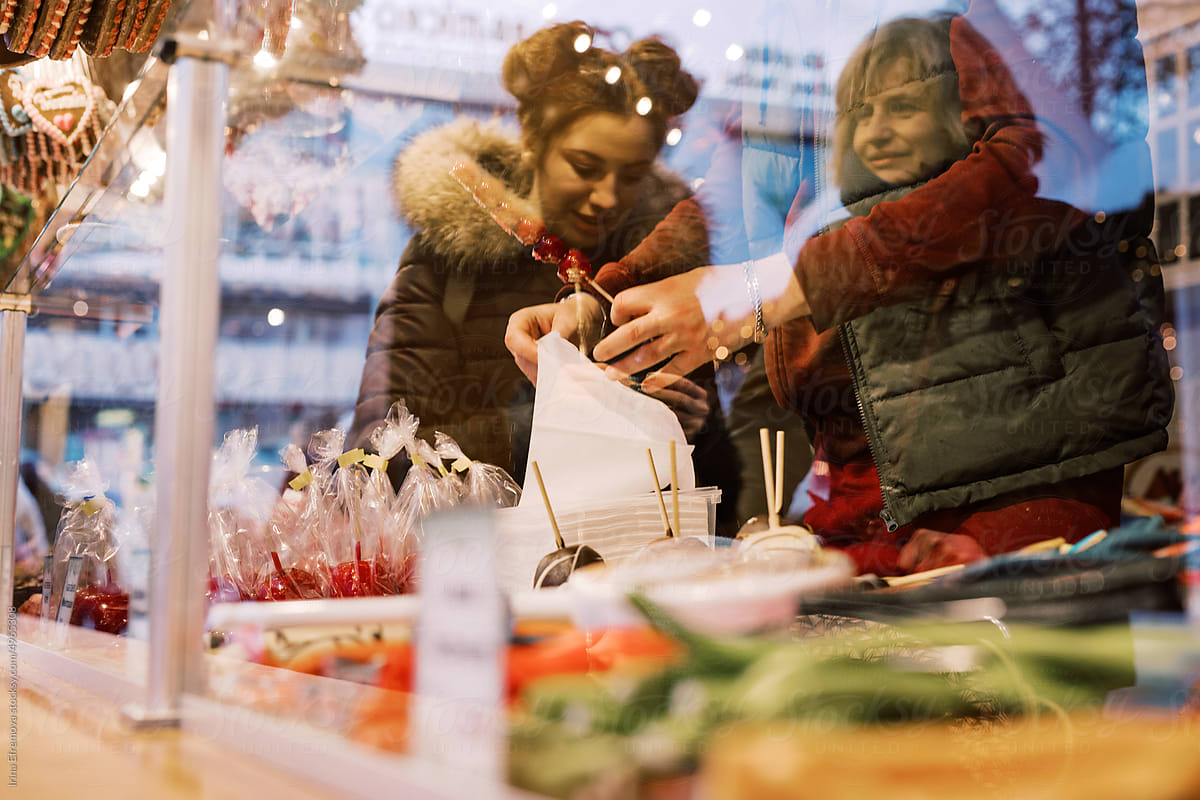 Christmas Market Moments: Women Buying Sweets