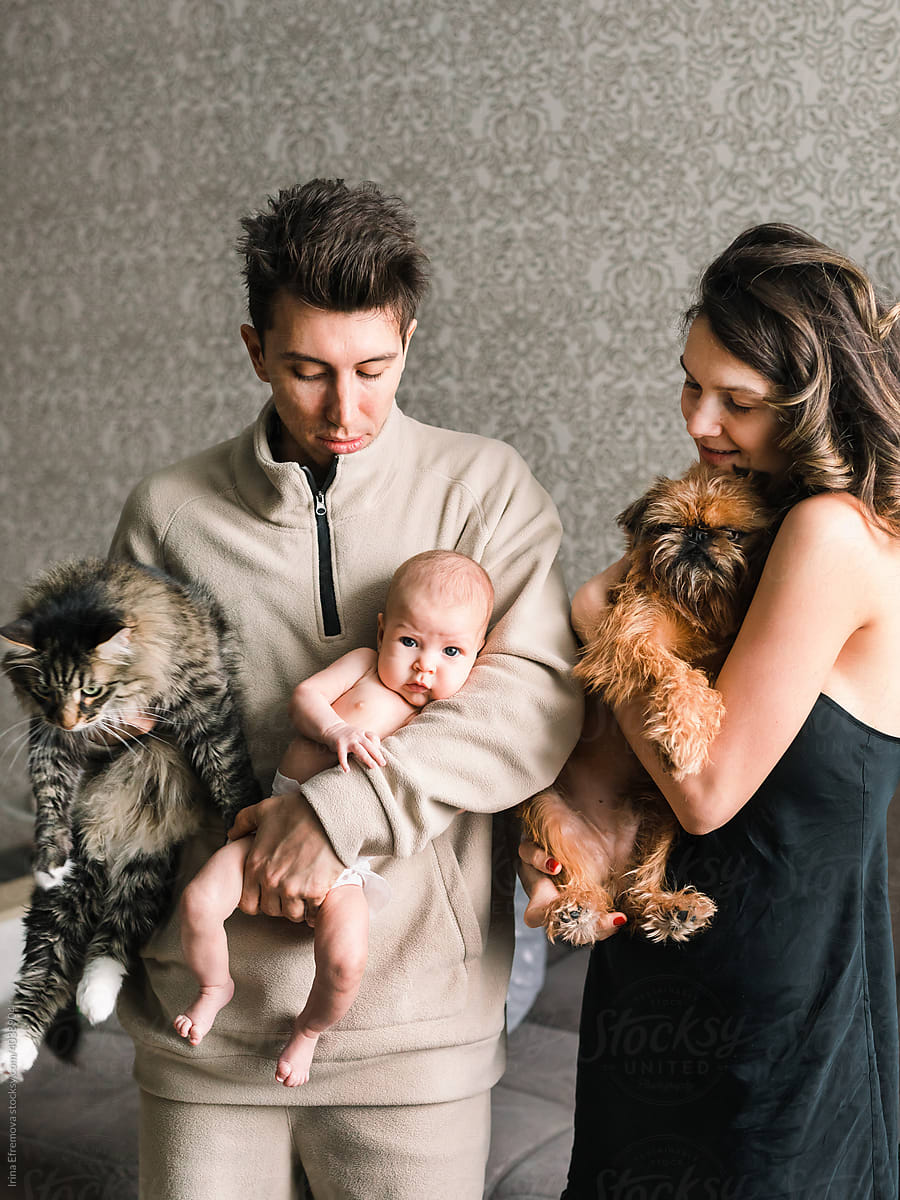 Family of three humans and two pets