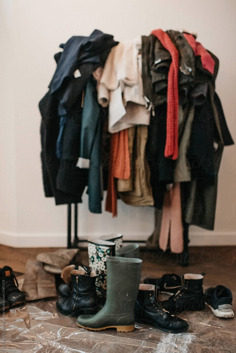 shoes and jackets stacked indoors after a winter walk