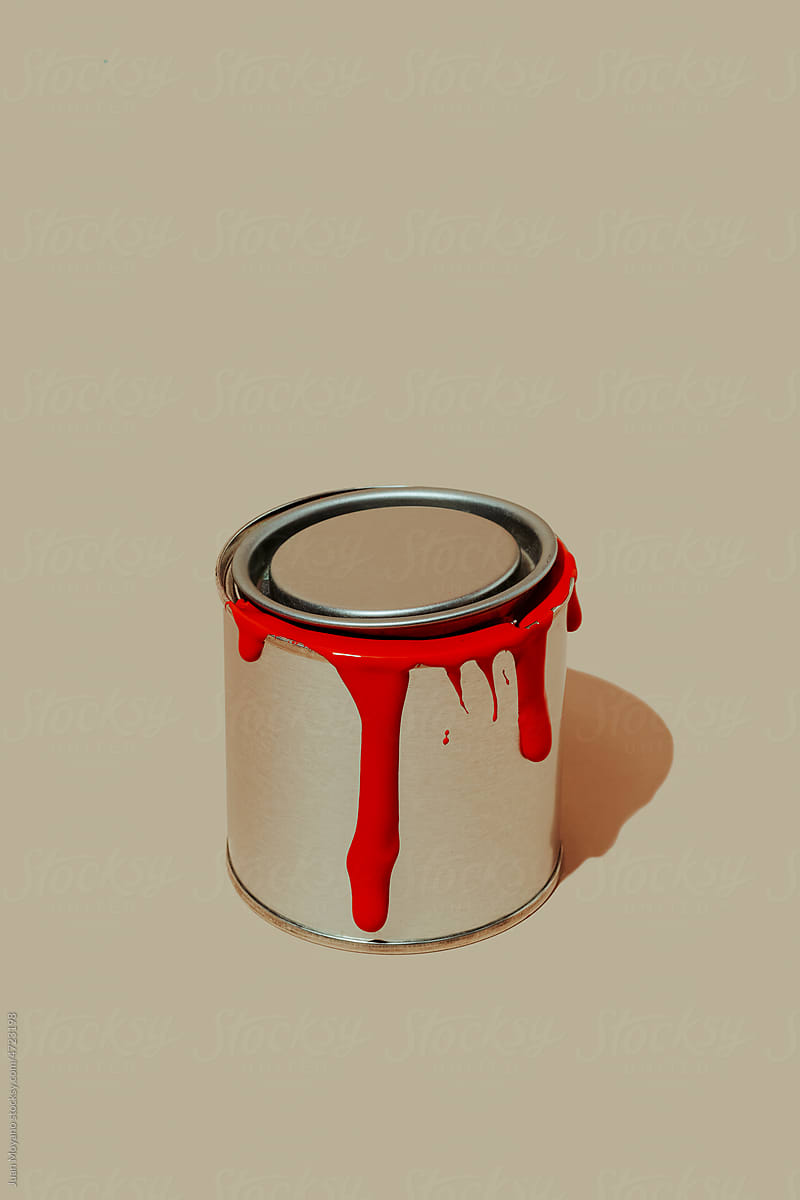 paint can with traces of fresh red paint