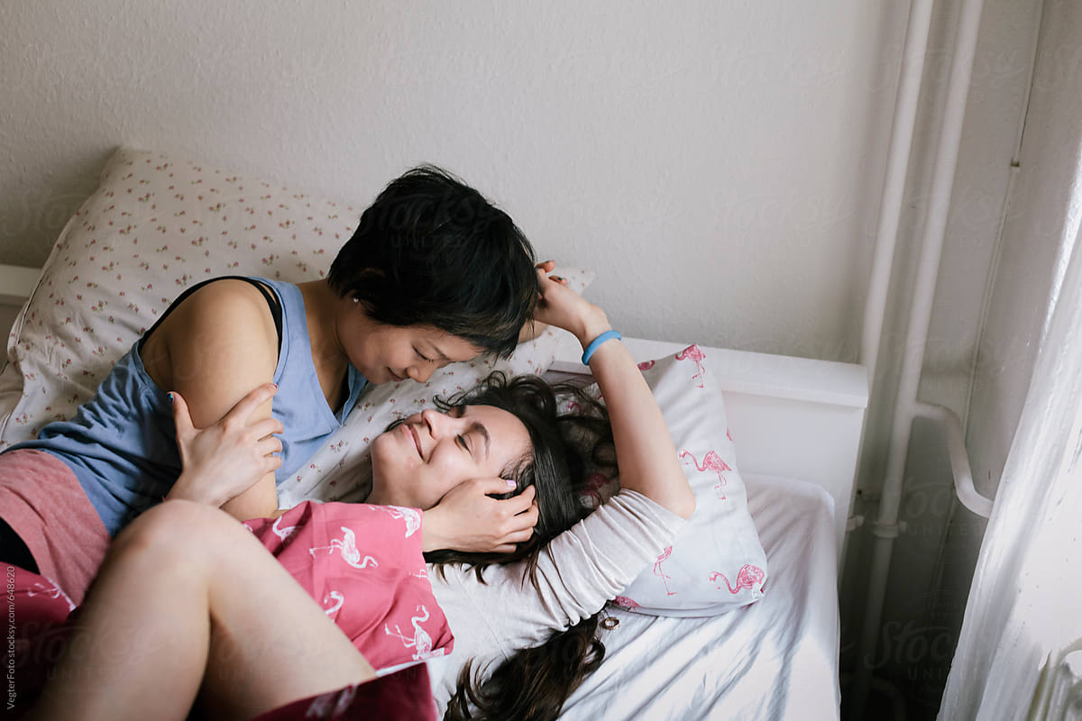 Romantic Lesbian Couple Sharing Time In Bedroom/ picture