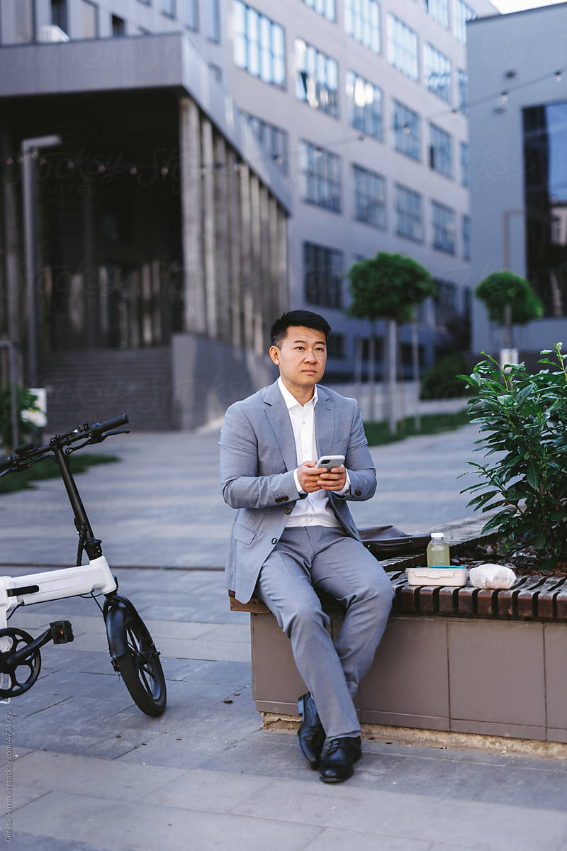 Entrepreneur using phone during lunch break