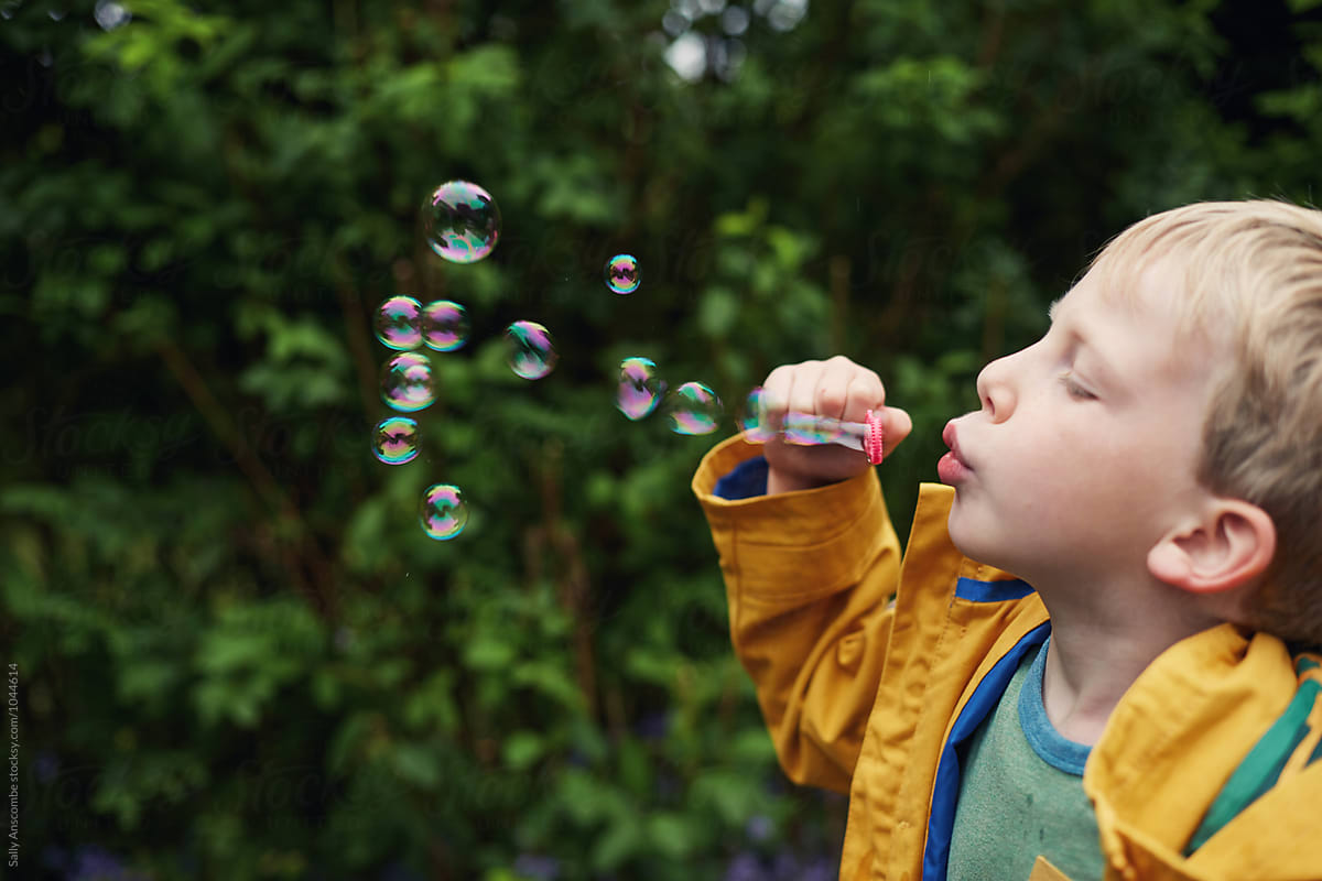 Child Blowing Bubbles By Sally Anscombe Child Bubble Stocksy