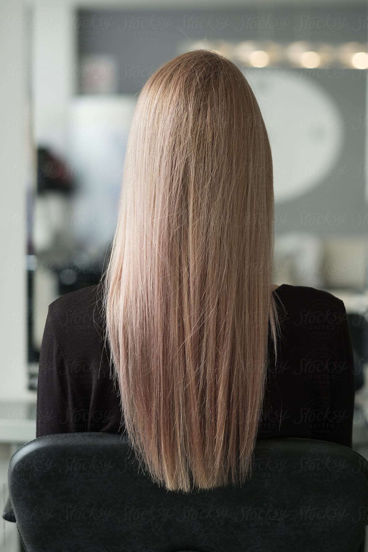 Back View Of Woman With Beautiful Long Hair At Hair Salon By
