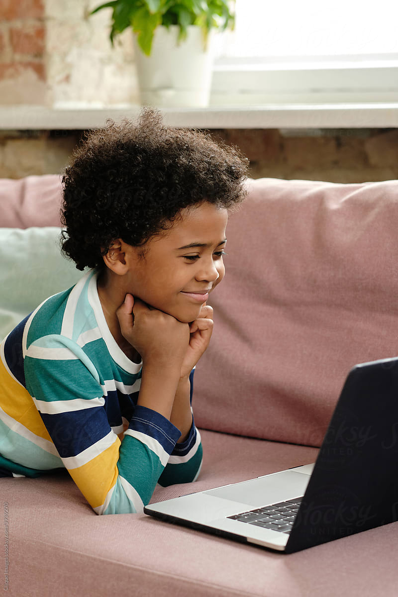 Boy Watching Cartoons On Laptop