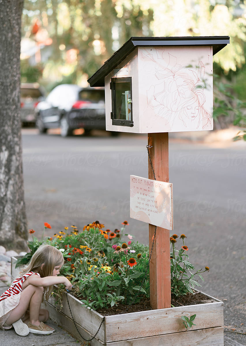 a free library and flower garden