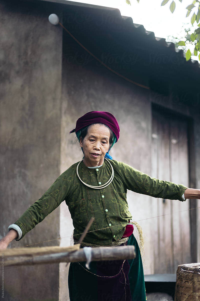 Hmong woman weaving in a workshop in the countryside in Ha Giang