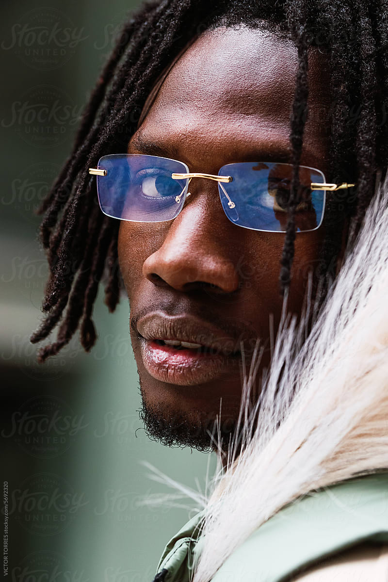 Black man in eyeglasses on street