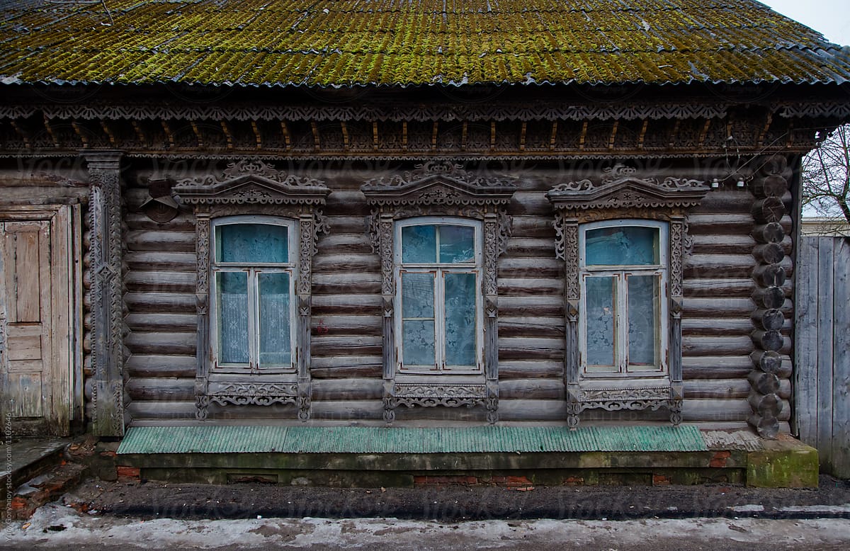 Facade of an old Russian house with carved and carved architraves windows