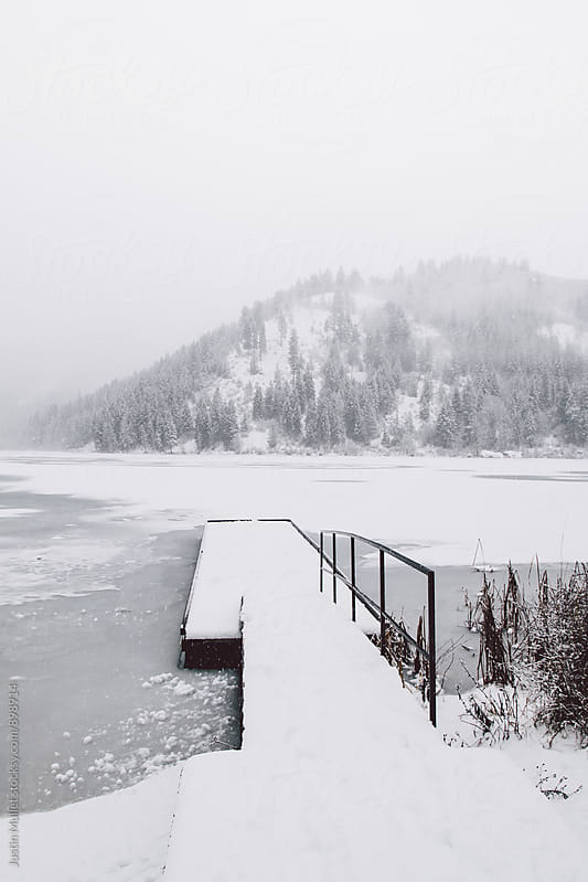 Snow covered dock on a ice covered lake