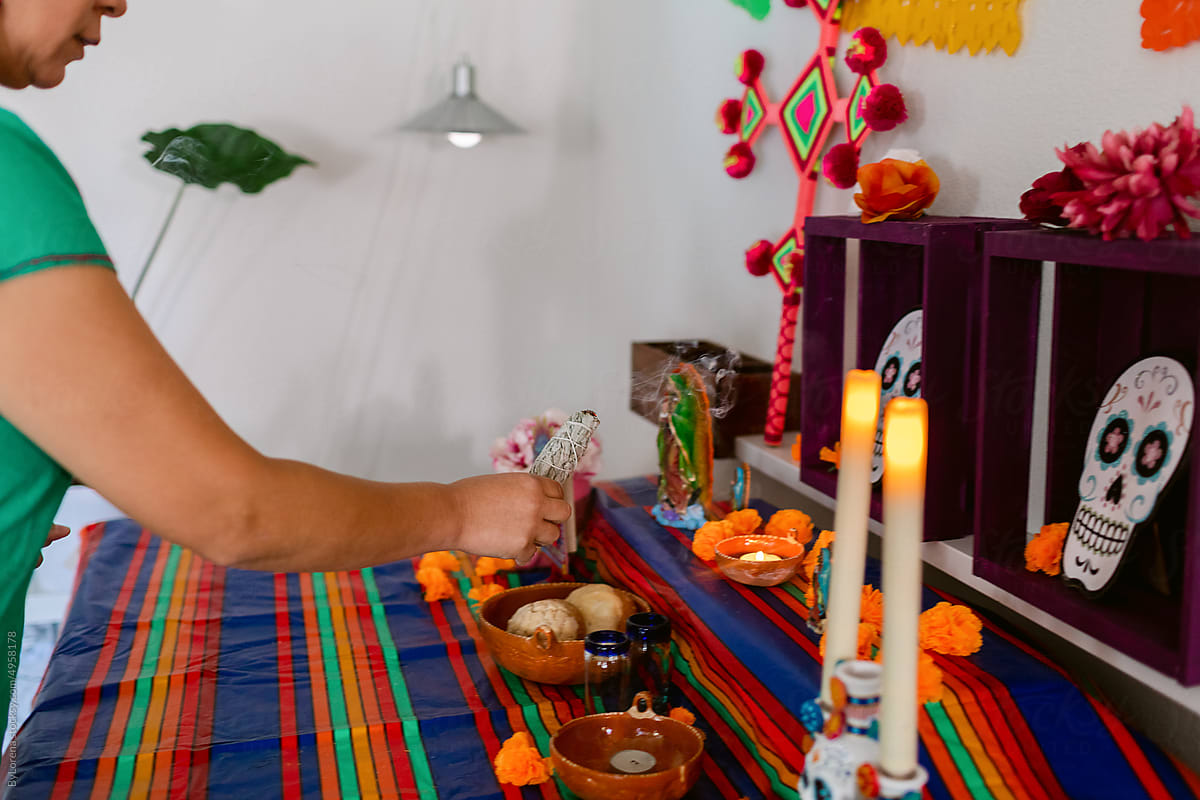 Mexican with palo santo in home shrine \