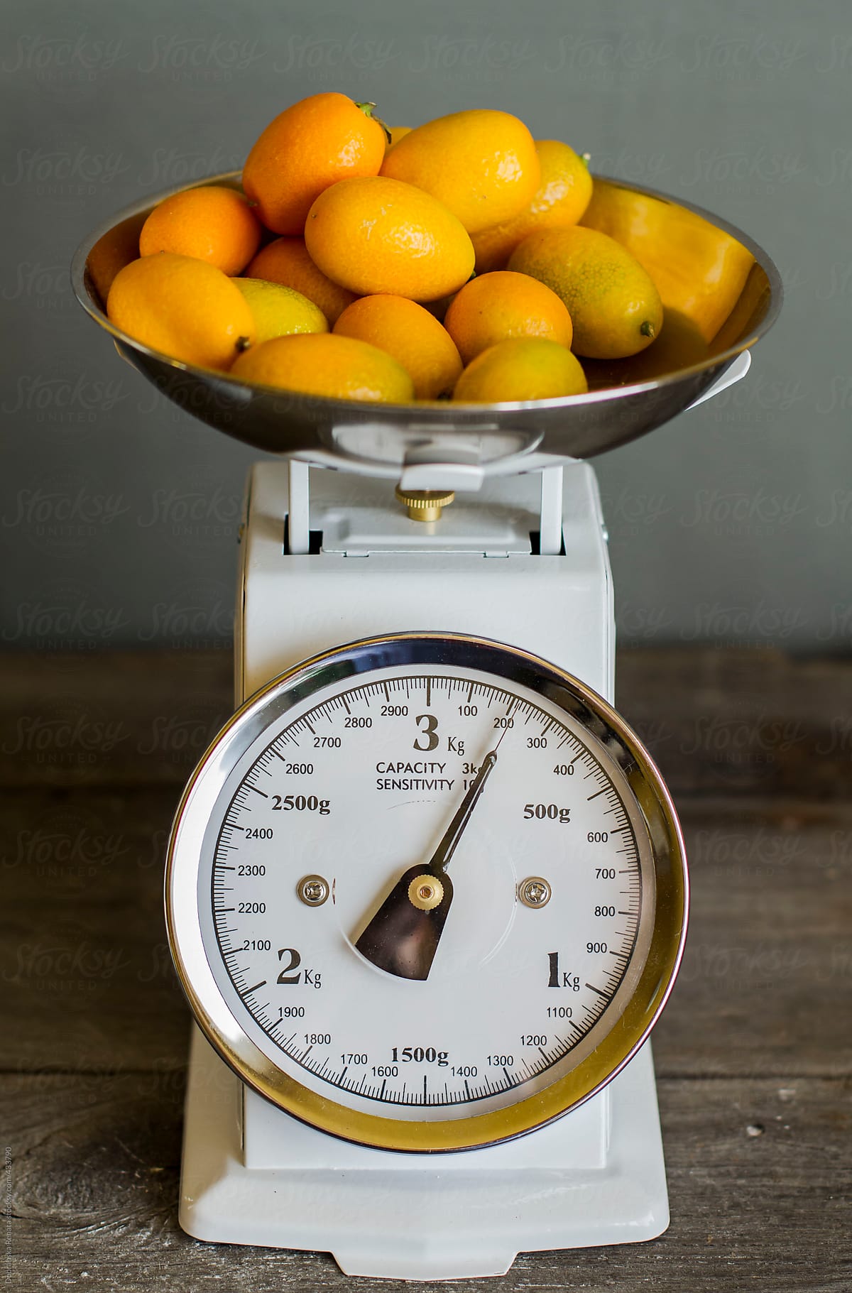 Kumquat on Vintage Kitchen Scales