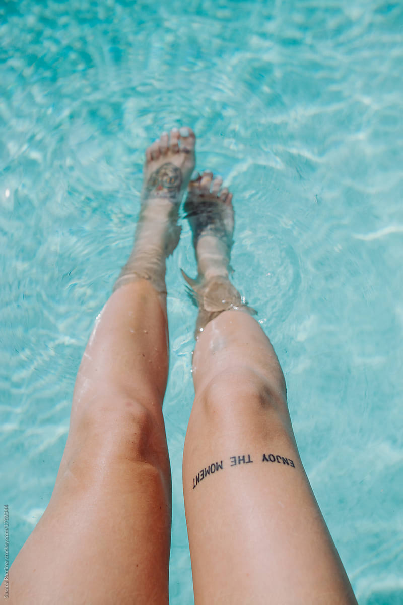 Woman legs in the pool