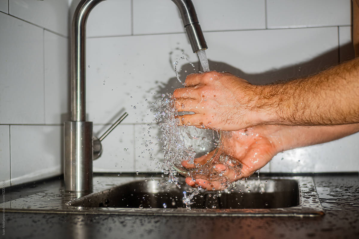 Washing Dishes With Splashes Of Water Action