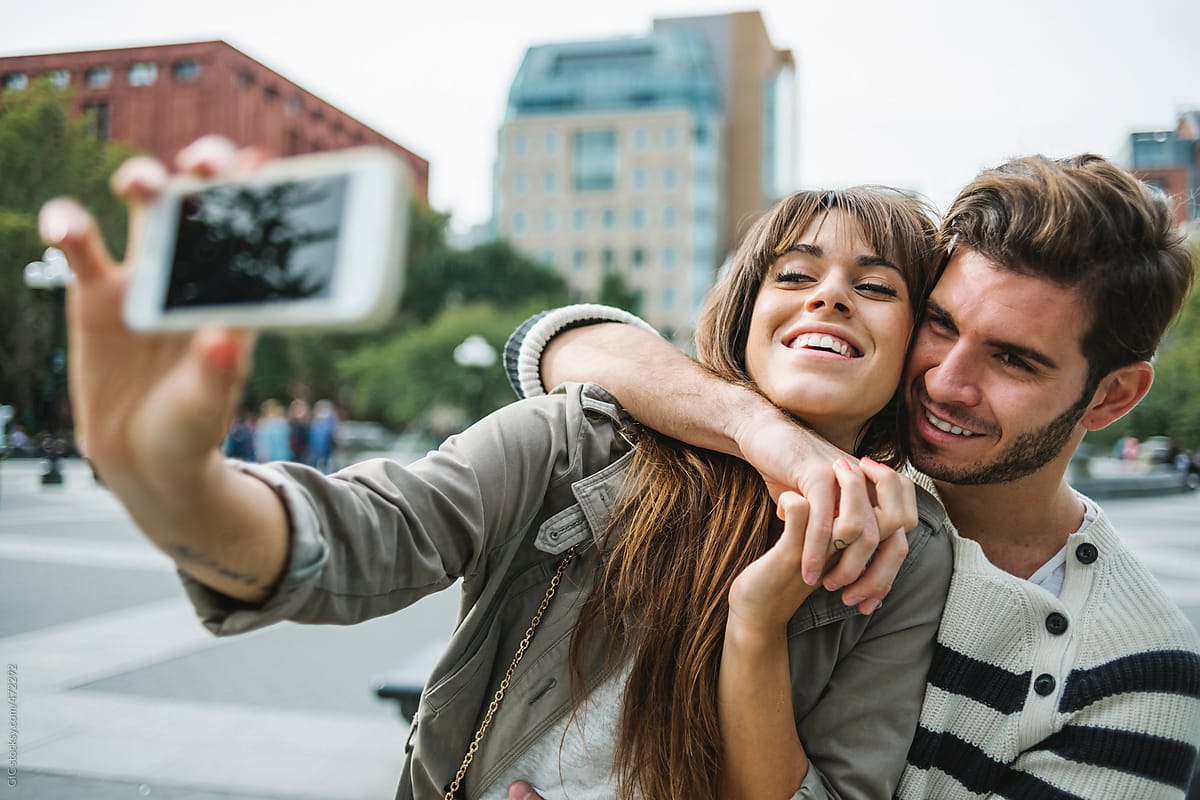Happy Couple Taking A Selfie In New York City By Stocksy Contributor Simone Wave Stocksy