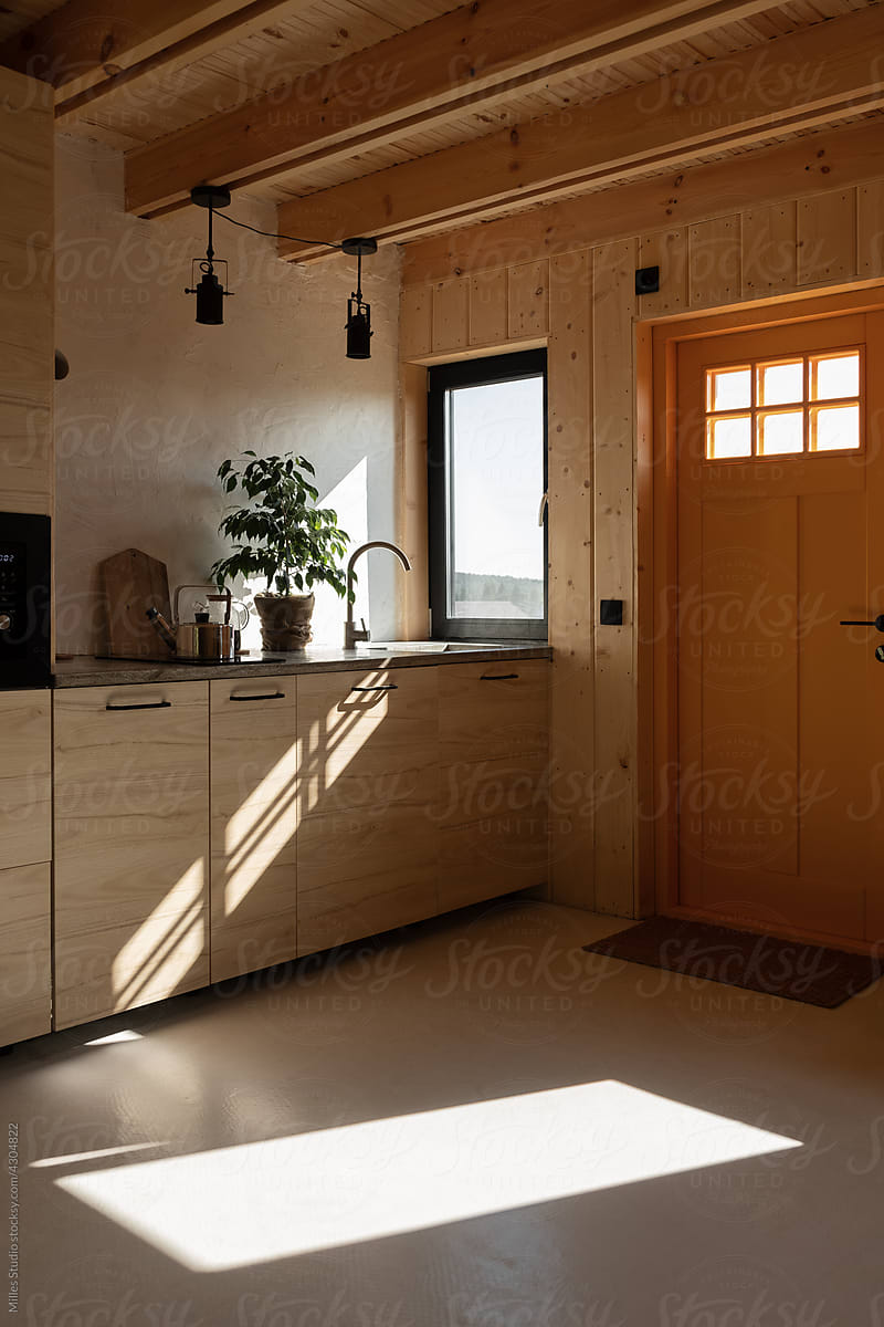 Kitchen of countryside house illuminated with sunlight