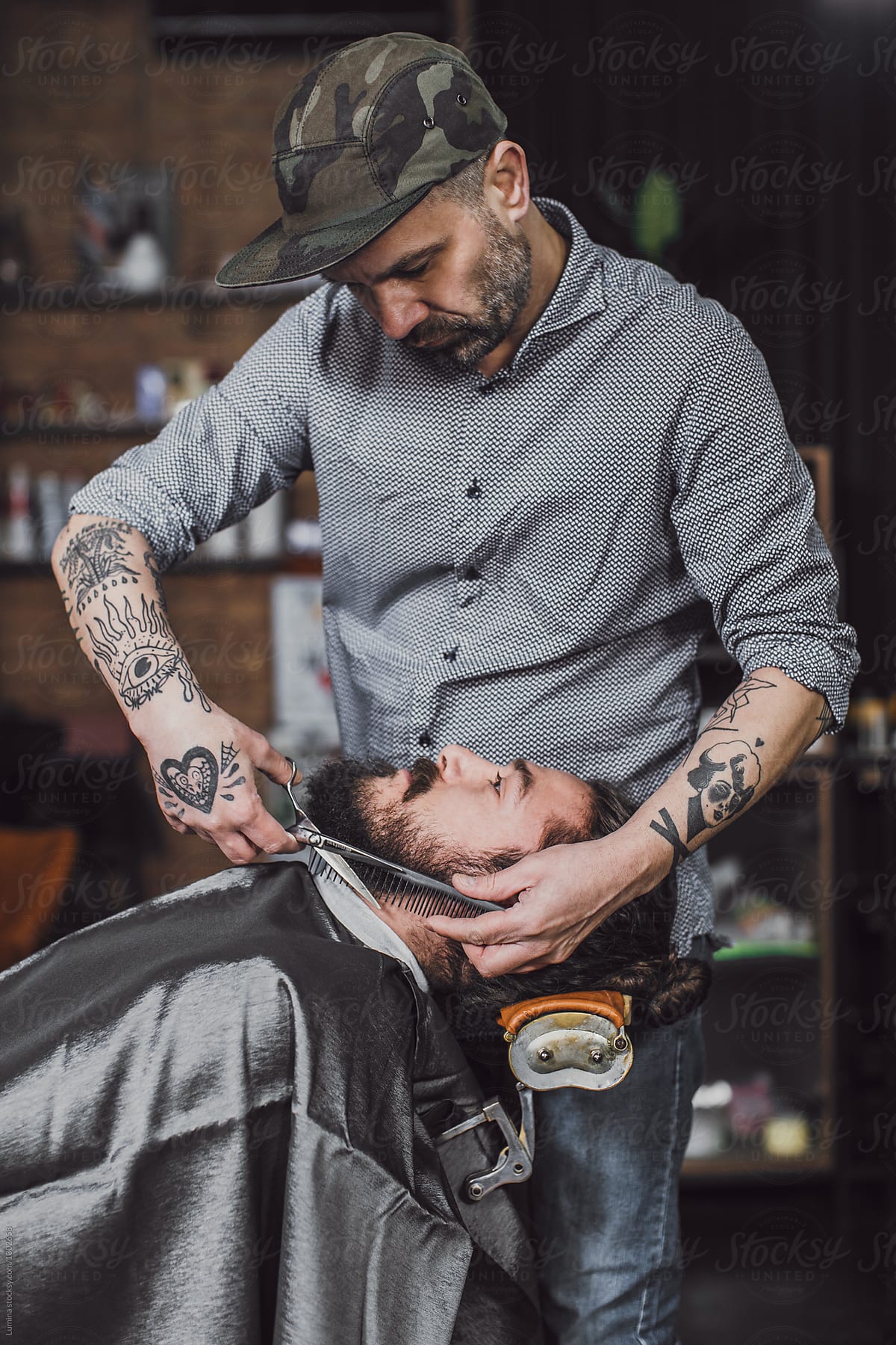 Barber Trimming A Beard